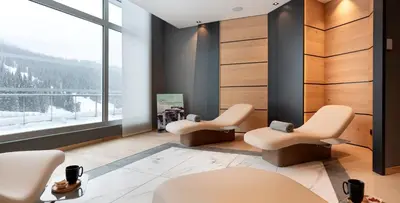 a waiting room with two chairs and a window at MGM Hôtels & Résidences - Résidence Alhéna in Flaine