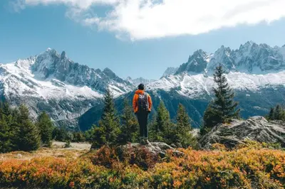 a man standing on top of a mountain looking at the mountains at Apartment Grepon 6 Incredible Mont Blanc View Chamonix in Chamonix-Mont-Blanc