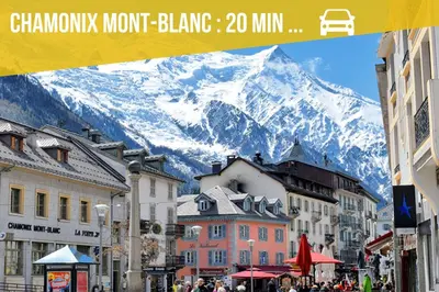 a view of a snow covered mountain in a city at Duplex Sallanches - Terrasse, Centre & Parking by AlpenlySallanches in Sallanches