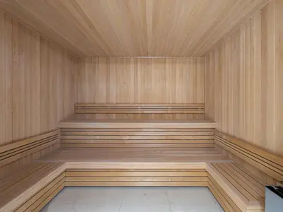 an empty sauna with wooden walls and wooden floors at Bel appartement à Megève dans résidence avec piscine - FR-1-569-105 in Megève