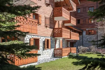 a building with balconies on the side of it at Résidence Les Fermes du Soleil - maeva Home - Appartement 3 pièces 5 personnes - Sélection MAE-9504 in Les Carroz d'Araches