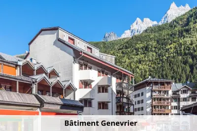 a group of buildings in front of a mountain at L'Aiguille - maeva Home - 2 Pièces 5 Personnes - Sélection MAE-4175 in Chamonix-Mont-Blanc
