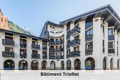 a building with balconies on the side of it at L'Aiguille - maeva Home - 2 Pièces 5 Personnes Confort MAE-2139 in Chamonix-Mont-Blanc