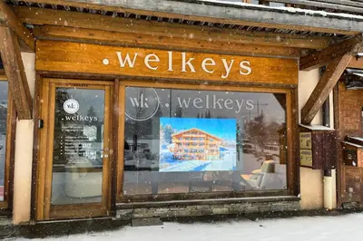 a store window with the words walesleys on it at Le Chalet Vigas - Welkeys in Megève