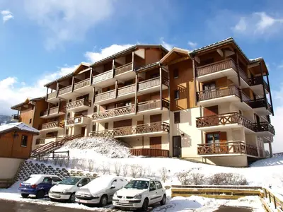 a balcony of a building with a snow covered mountain at Apartment Les Hauts de Saint Gervais-11 by Interhome in Saint-Gervais-les-Bains