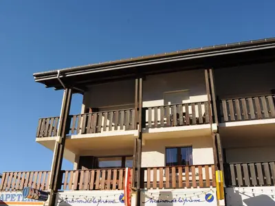 a building with balconies on the side of it at Charmant appartement rénové au cœur de Samoëns, proche skibus - FR-1-624-145 in Samoëns