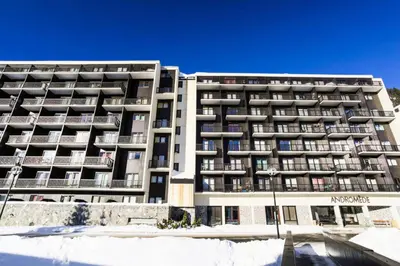 an apartment building with snow in front of it at Résidence Andromède - maeva Home - Appartement 2 pièces 6 personnes Confort MAE-3514 in Flaine