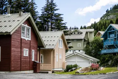 a row of houses in a village at Les Chalets de Flaine Hameau - maeva Home - Chalet 5 Pièces 8 Personnes - Confort MAE-3661 in Flaine