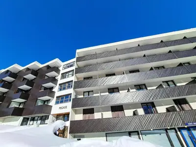 an apartment building with snow in front of it at Résidence Pégase - maeva Home - Studio 4 Personnes - Budget MAE-3664 in Flaine