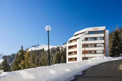 a building with a street light in the snow at Résidence Arche - maeva Home - Studio 4 Personnes - Confort MAE-3695 in Arâches-la-Frasse