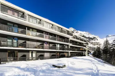 a large building with snow in front of it at Résidence Castor - maeva Home - Appartement 2 Pièces 6 Personnes - Confort MAE-3850 in Arâches-la-Frasse