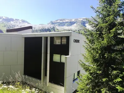 a building with a tree in front of it at Résidence Castor - maeva Home - Appartement 2 Pièces 6 Personnes - Confort MAE-3850 in Arâches-la-Frasse
