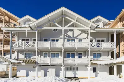 a large white apartment building with a balcony at Résidence Le Château de Crans - maeva Home - Appartement 2 Pièces 6 Personnes - Prestige MAE-4253 in Flaine