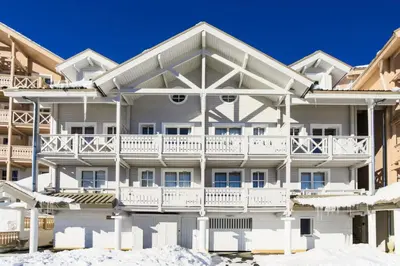 a white apartment building with a balcony at Résidence Le Château de Crans - maeva Home - Appartement 3 Pièces 8 Personnes - Confort MAE-4488 in Flaine