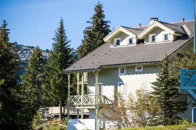 a large white house with a gray roof at Résidence Arbaron - maeva Home - Studio 4 personnes - Confort MAE-8638 in Flaine