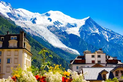 a group of people sitting on top of a mountain at Residence Edelweiss - Chamonix All Year in Chamonix-Mont-Blanc