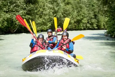 a group of people in a raft on a river at Le Bartavel Apartment - Chamonix All Year in Chamonix-Mont-Blanc