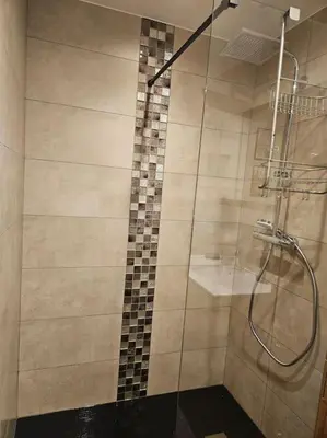 a bathroom with a shower with a glass door at Charmant T1 montagnard proche télécabine in Saint-Gervais-les-Bains
