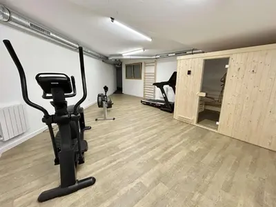 a room with a gym with exercise equipment in it at Appartement 3 pièces, 4/6 couchages à Combloux avec parking - FR-1-597-178 in Combloux