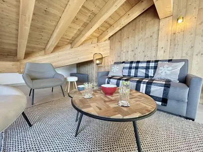 a living room with a couch and a table at Appartement 3 pièces, 4/6 couchages à Combloux avec parking - FR-1-597-178 in Combloux