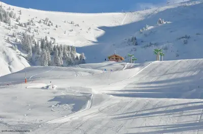 a snow covered mountain with a house in the background at ob219 4 pieces duplex 6 personnes proche pistes in Les Carroz d'Araches