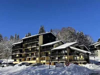 a apartment building in the snow with snow covered at Studio cabine rénové près ski bus, 4 couchages - FR-1-572-301 in Arâches-la-Frasse