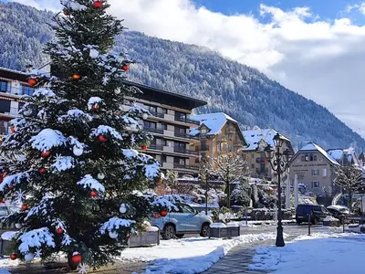a christmas tree in a parking lot with snow at Apartment La coupe de Cristal by Interhome in Saint-Gervais-les-Bains