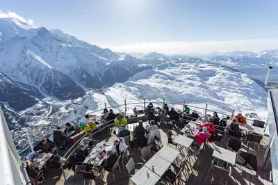 a group of people sitting on top of a mountain at Les Trois Balcons Apartment - Chamonix All Year in Chamonix-Mont-Blanc