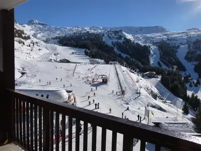 people standing in the snow in front of a large building at Appartement skis aux pieds à Flaine avec parking et piscine - FR-1-425-227 in Arâches-la-Frasse