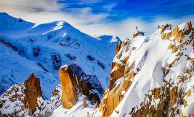a mountain covered in snow with a person on it at Batiment F - A Chamonix Mont Blanc Panorama in Chamonix-Mont-Blanc