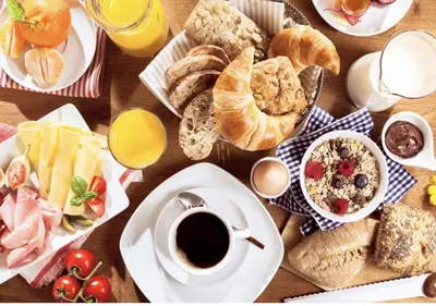 a table full of breakfast foods and coffee on a table at Apartment Camox, Les Houches - by EMERALD STAY in Les Houches