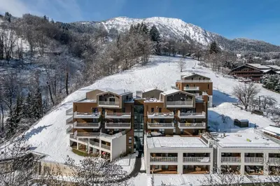 an apartment building on top of a snow covered hill at Apartment Houchma Les Houches - by EMERALD STAY in Les Houches