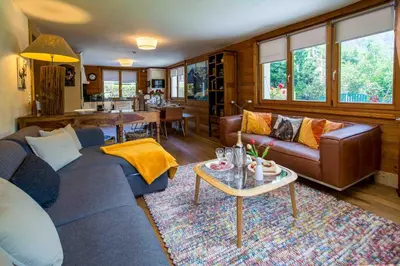 a living room with a couch and a coffee table at Edelweiss apartment - Chamonix All Year in Chamonix-Mont-Blanc