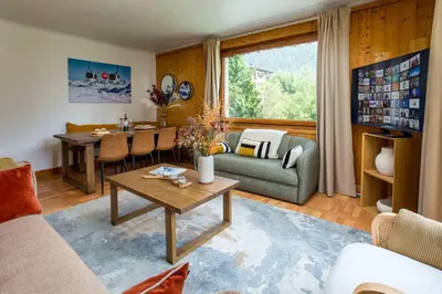 an image of a house with mountains in the background at Edelweiss 2 Apartment and Studio - Chamonix All Year in Chamonix-Mont-Blanc