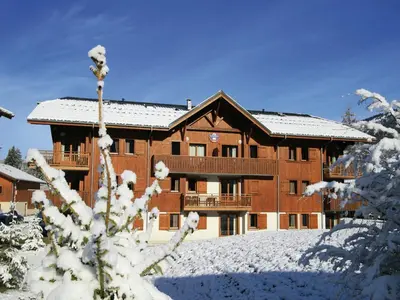 a living room with a pool table in a cabin at Mountain Retreat for Families in Samoëns