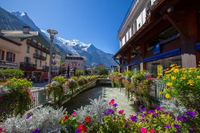 a mountain with a monastery on top of it at Clos Du Savoy - South Facing Balcony - Happy Rentals in Chamonix-Mont-Blanc