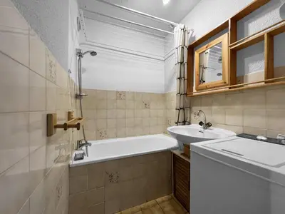 a bathroom with a tub and a sink at BA332 Appartement 4 6 Pers Pied de pistes Carroz in Les Carroz d'Araches