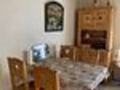 a dining room with a table and some chairs at Studio cosy à Samoëns pour 4 personnes - FR-1-846-21 in Samoëns