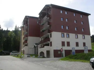 a large building with snow on top of it at Appartement 3 pièces, 6 personnes, au pied des pistes - Morillon 1100 - FR-1-815-103 in Morillon