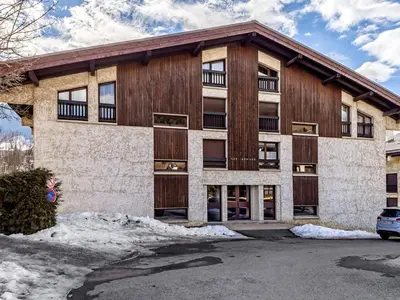 a bedroom with a bed and a large window at Appartement rénové 1 chambre cabine, Megève, proche centre - FR-1-453-327 in Megève