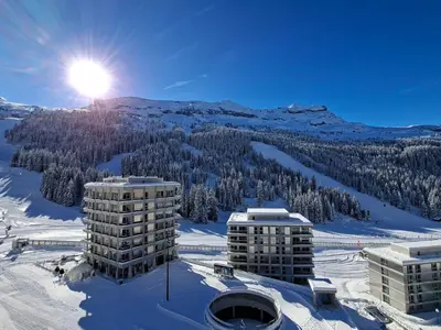 a dining room with a table and chairs at Appartement spacieux, ski aux pieds, balcon, 3 pièces, 6-8 personnes - FR-1-425-238 in Arâches-la-Frasse