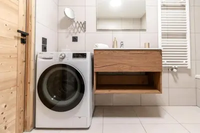 a kitchen with a washing machine and a sink at Bright apartment ideal in Les Houches for 4 in Les Houches