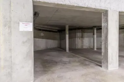 an empty parking garage with concrete walls and concrete floors at Bright apartment ideal in Les Houches for 4 in Les Houches