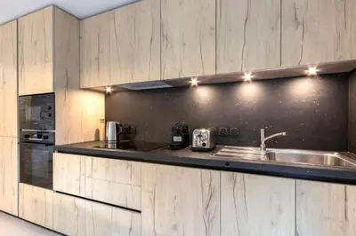 a kitchen with a sink and a counter at Bright apartment ideal in Les Houches for 4 in Les Houches