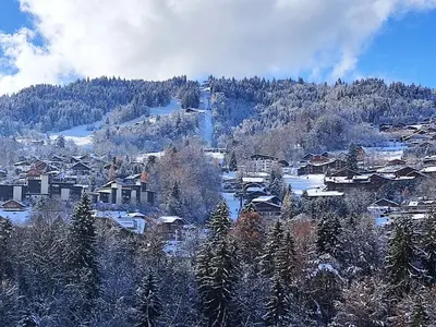 a village in the snow with a mountain at Studio Topaze-1 by Interhome in Saint-Gervais-les-Bains