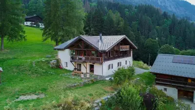 a house on top of a hill with trees at Prarion - Chalet Familial Vue360 Nature Calme Unique in Les Houches