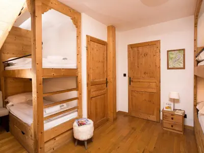 a bedroom with a bunk bed and a door at Apartment in Chamonix Centre-Ville by Interhome in Chamonix-Mont-Blanc