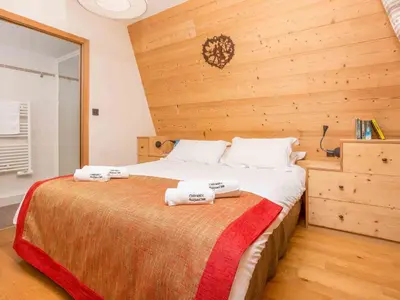 a bedroom with a bed with two towels on it at Apartment in Chamonix Centre-Ville by Interhome in Chamonix-Mont-Blanc