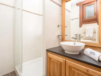 a bathroom with a sink and a shower at Apartment Wohnung in Chamonix Centre-Ville by Interhome in Chamonix-Mont-Blanc