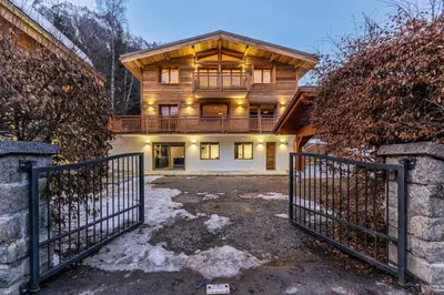 a house with a gate in front of it at Ocma2 Somptueux 6pax VueMtBlanc Central Parking in Chamonix-Mont-Blanc